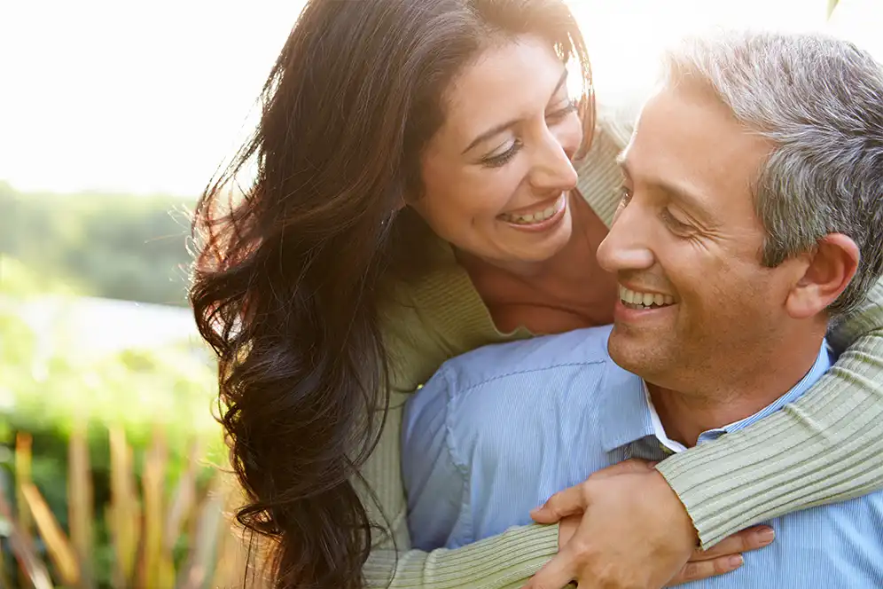 This is a banner image of a woman and man hugging.