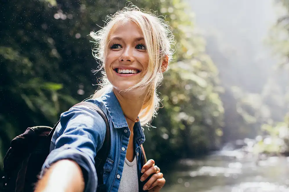 This is an image of a woman hiking.