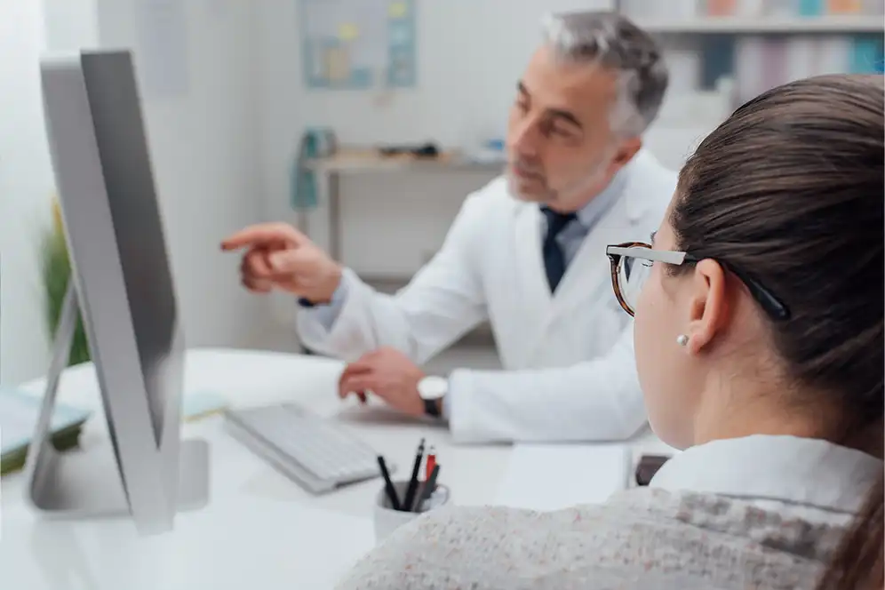 This is an image of a doctor consulting a client on IV Therapy.