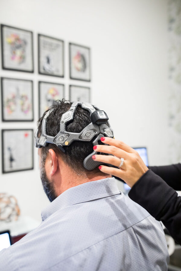 This is an image of a man receiving brain therapy.